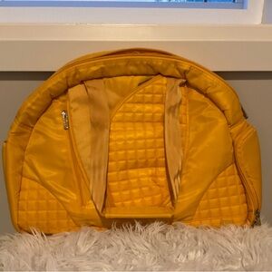 NWOT Lug Cartwheel fitness and overnight bag in yellow sateen fabric.